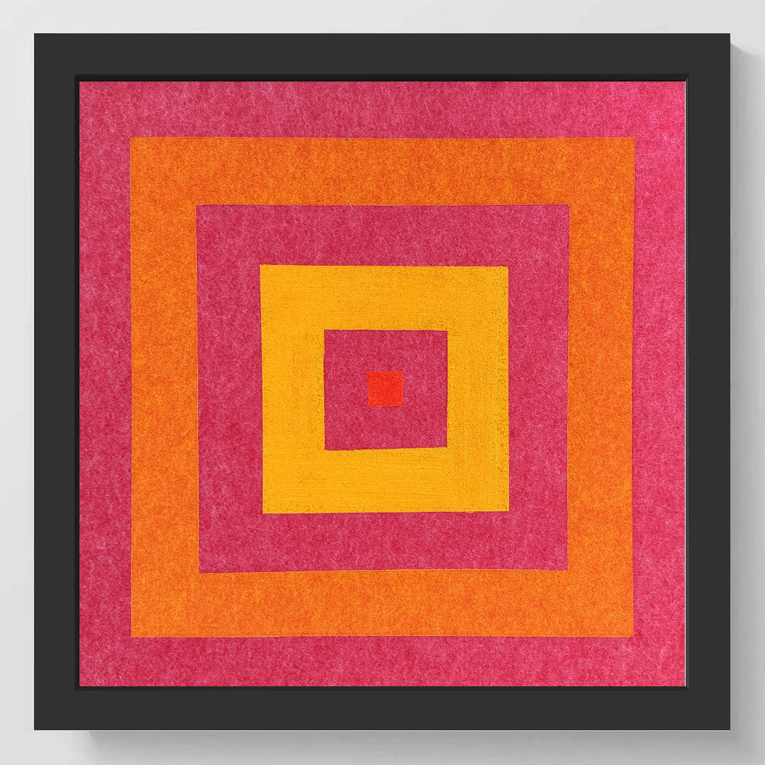 A square framed abstract art print featuring concentric squares in textured pink, orange, and yellow tones, set against a clean white background.