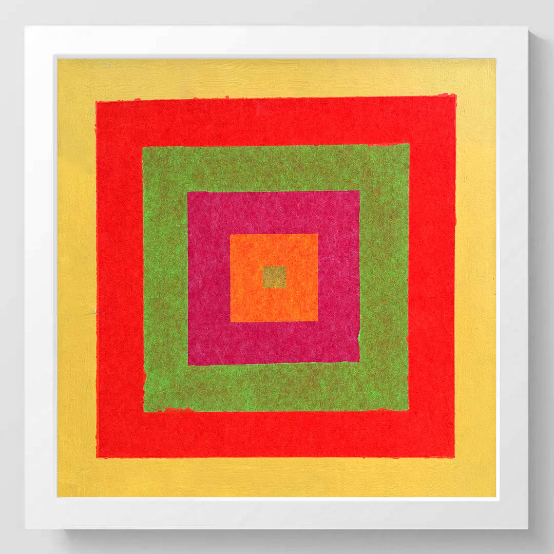 A framed square abstract artwork featuring concentric textured squares in yellow, red, green, magenta, and orange, presented in a white frame against a light gray wall.