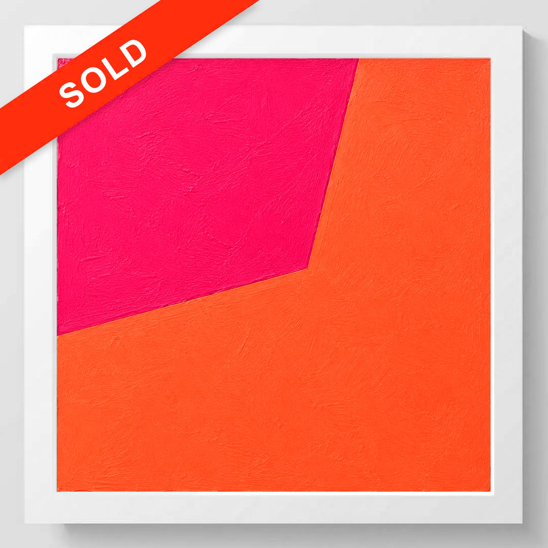 A framed abstract geometric wall art print with a bold orange and hot pink color-block design, shown against a light gray background with a red diagonal 'SOLD' banner overlay.